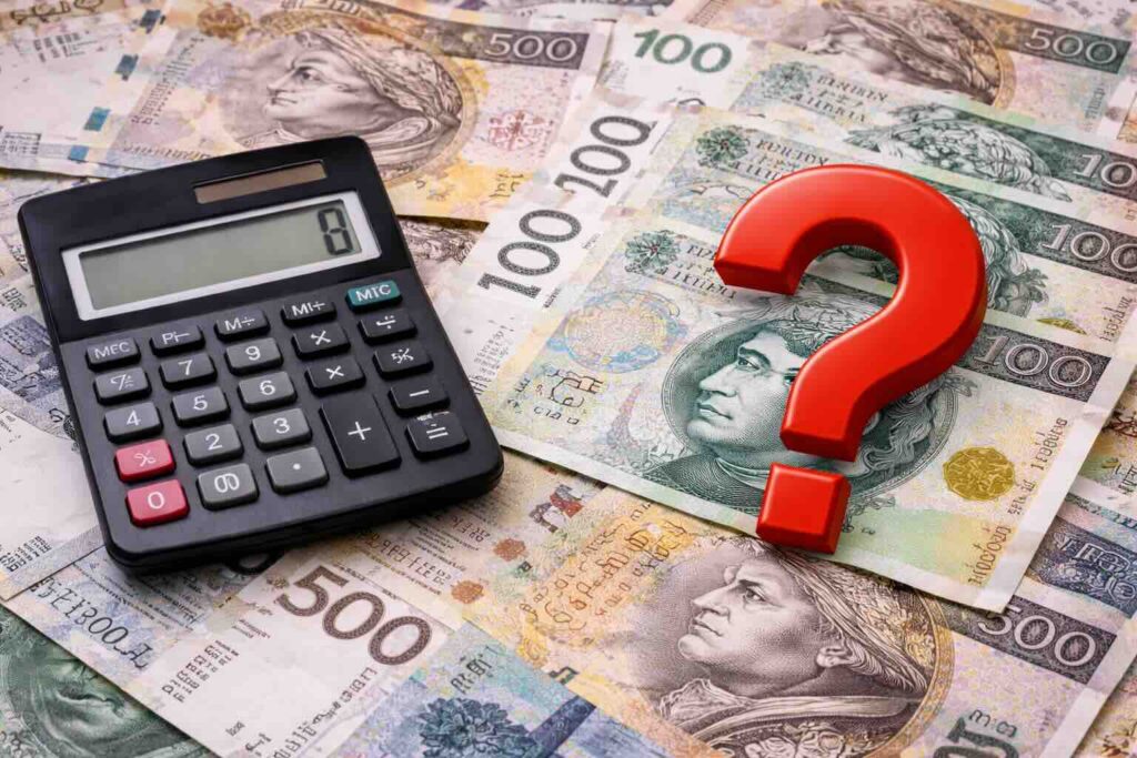 Wycena udziału w nieruchomości – kalkulator i dokumenty na biurku